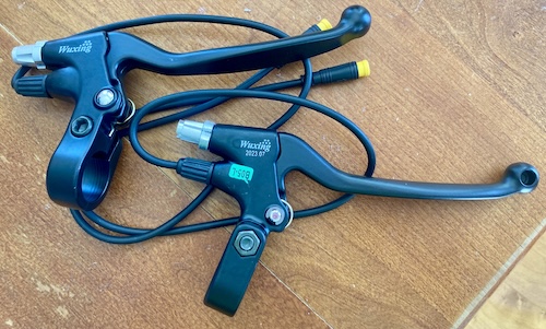 Some brake levers on a table.