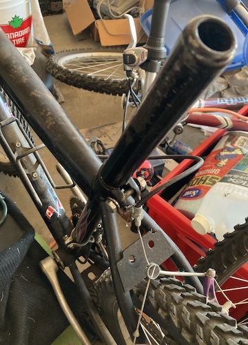 I am using a seat post as a mandrel to round out the seat tube on the Raleigh frame.